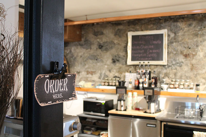 Picture of new coffee shop with Order Here sign