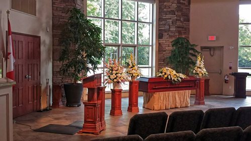 A church pulpit with a wreathed casket